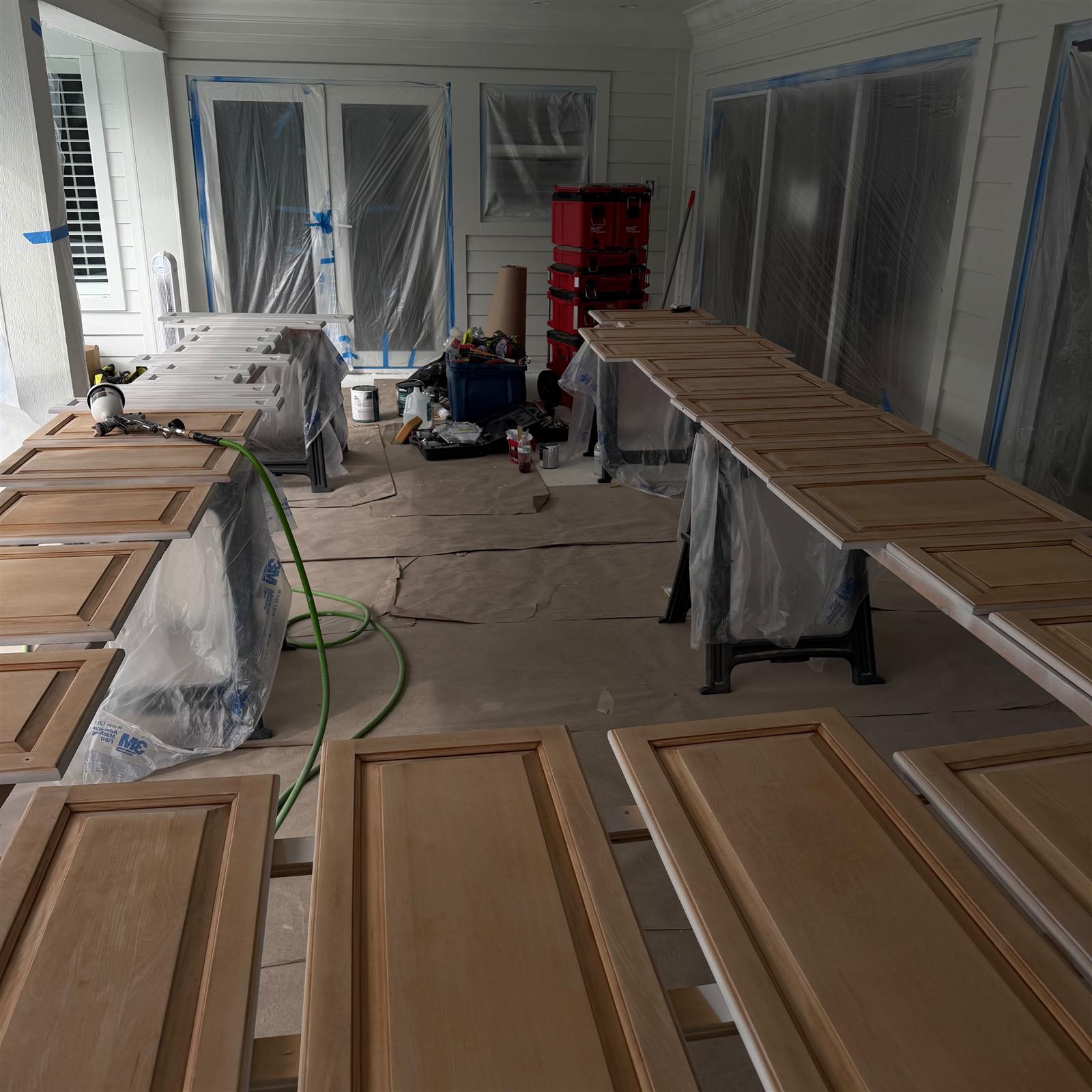 Spray equipment and prepped doors